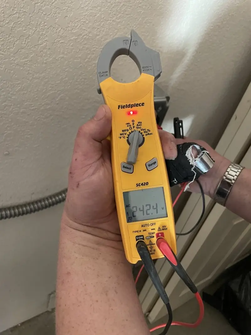 Voltage testing with clamp meter during Generator Installation in Bartlett